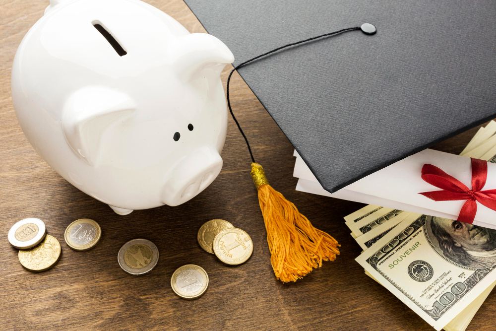 High Angle Piggy Bank With Academic Cap Coins.jpg