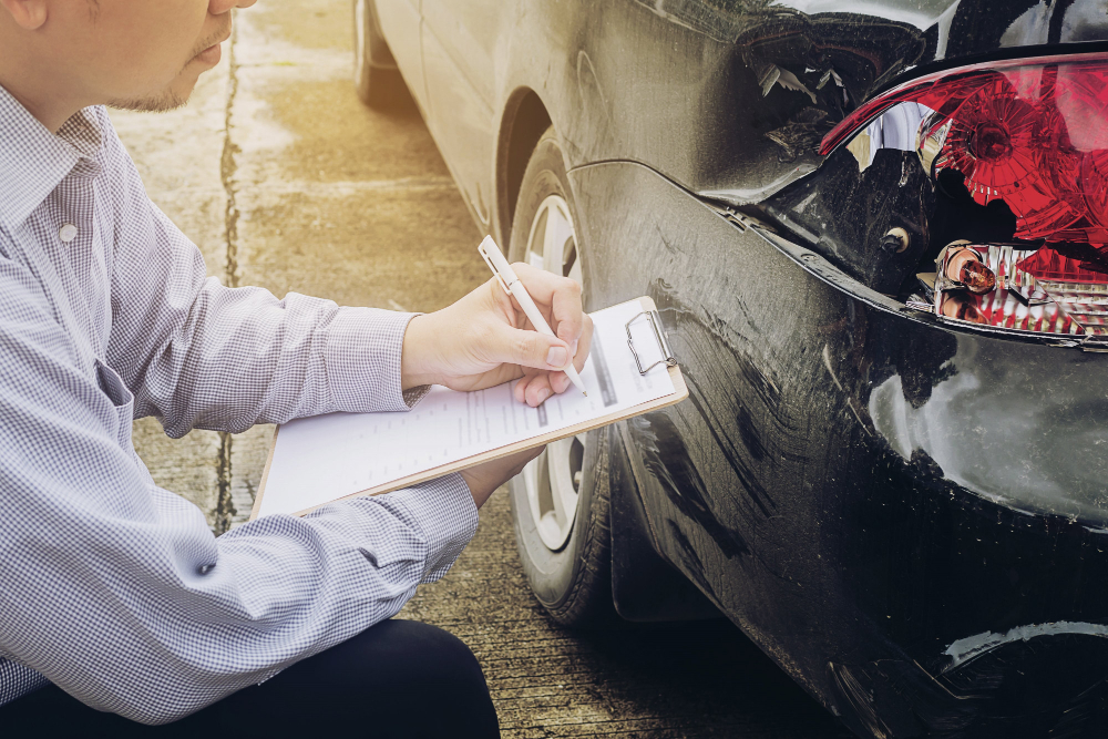 Insurance Agent Working Car Accident Claim Process.jpg